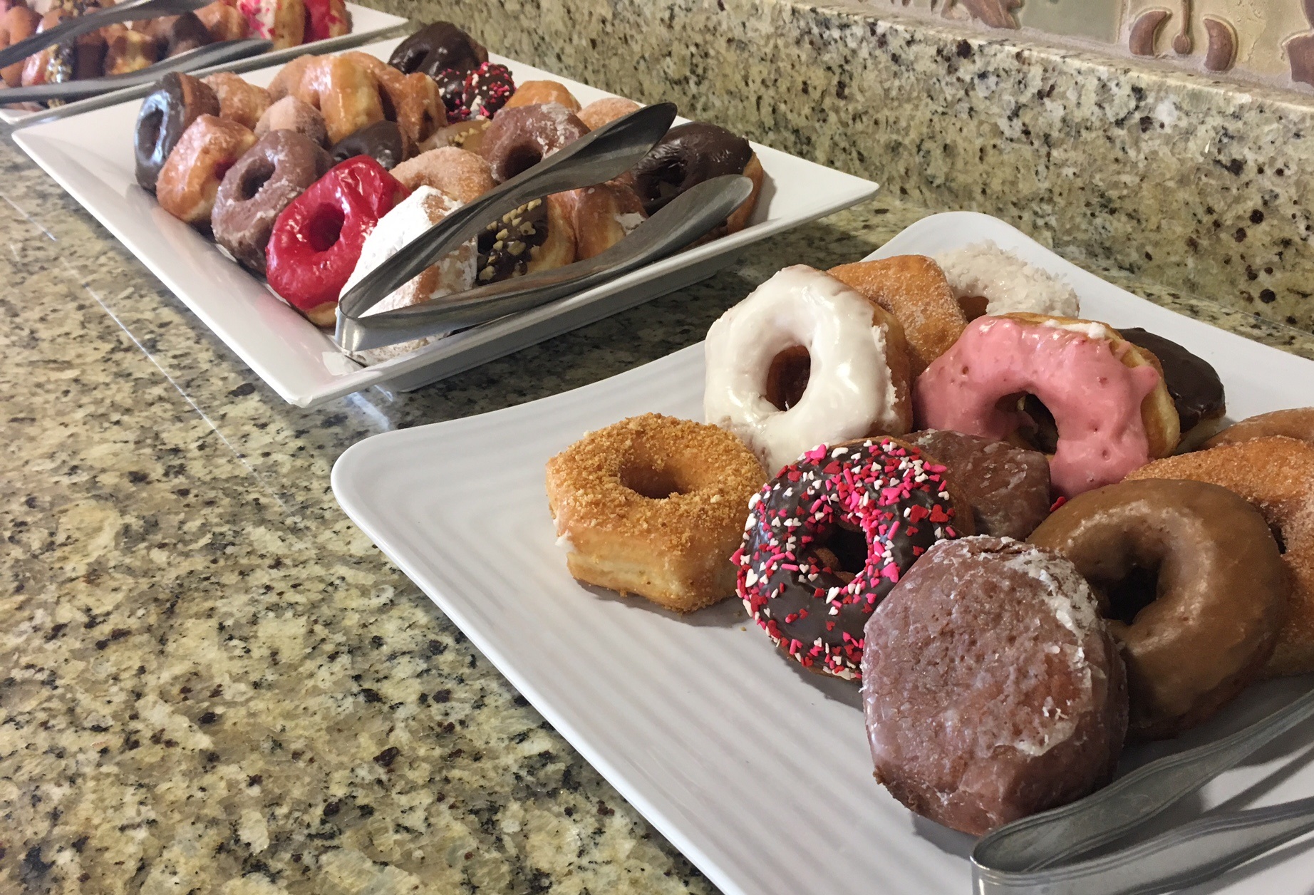 a tray full of doughnuts