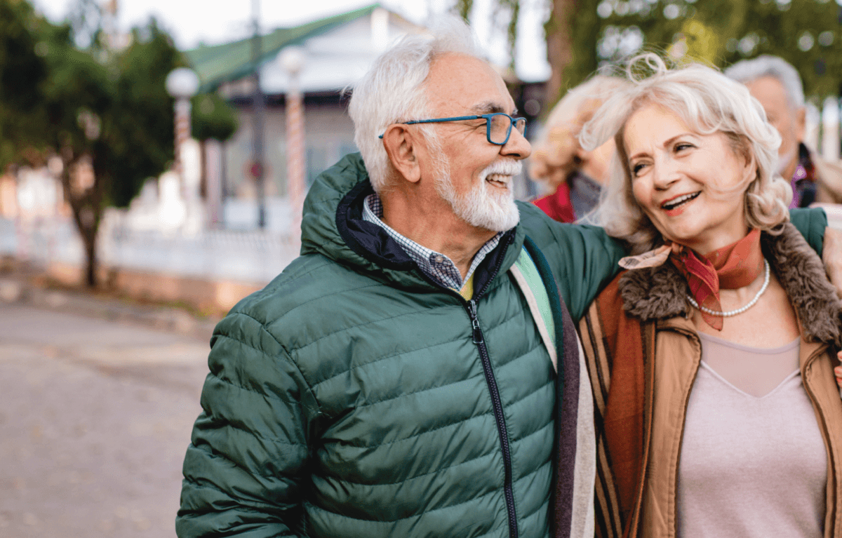 Senior couple walking around their town