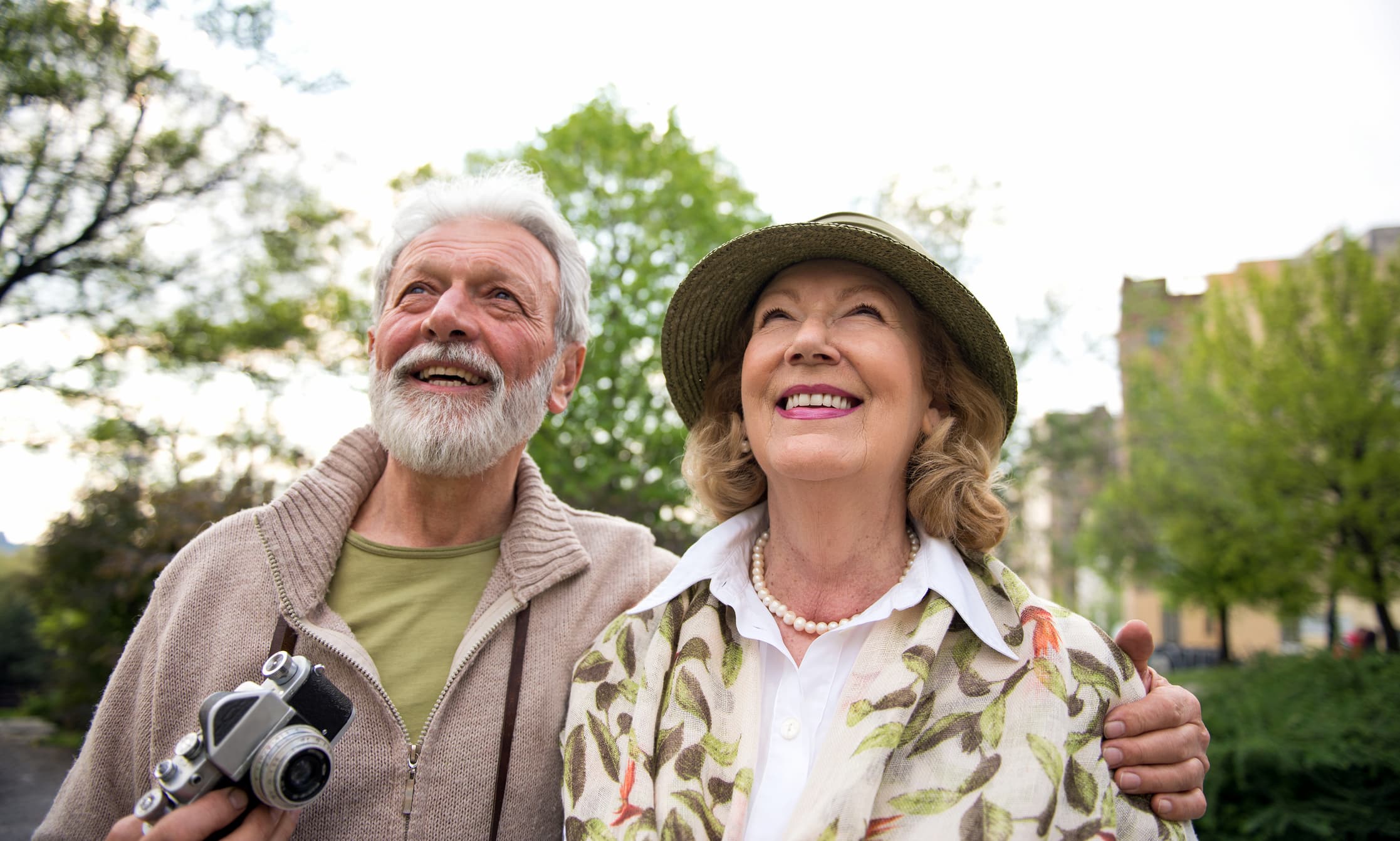 Senior couple smiles during tour