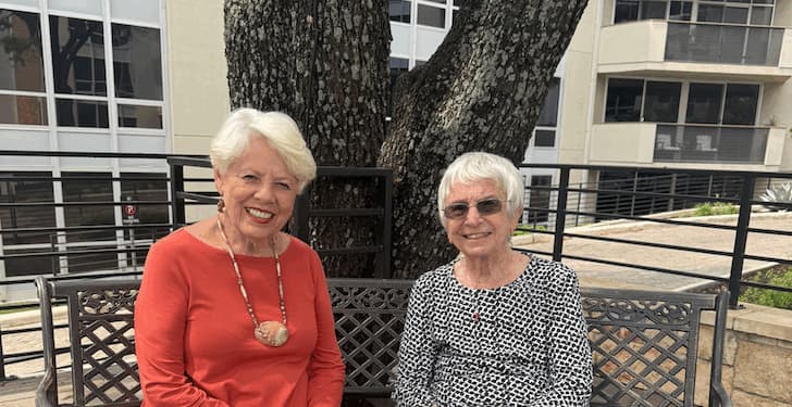 Judi Nudelman and Robbie Ausley sitting smiling