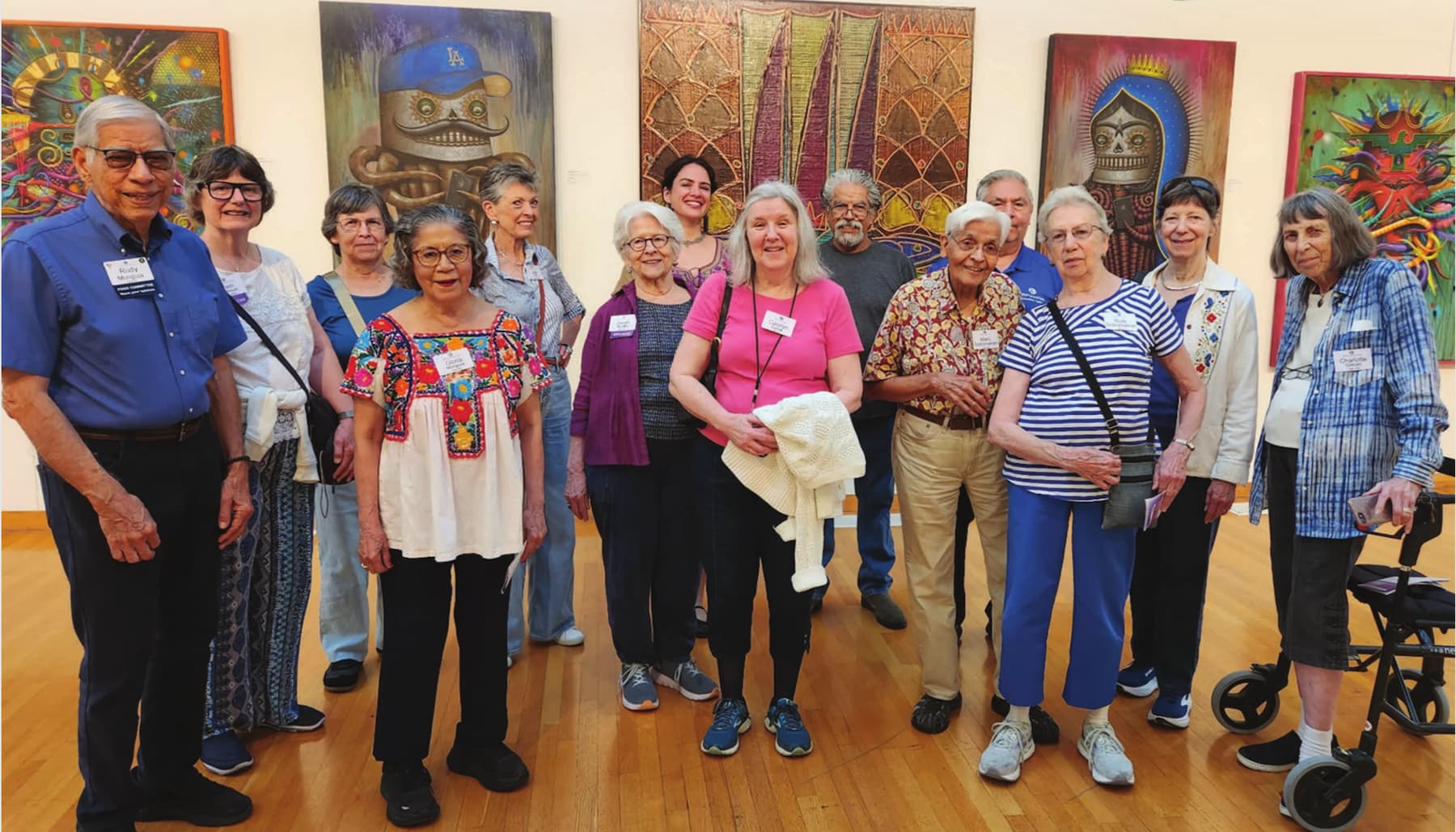 Residents smiling in art gallery