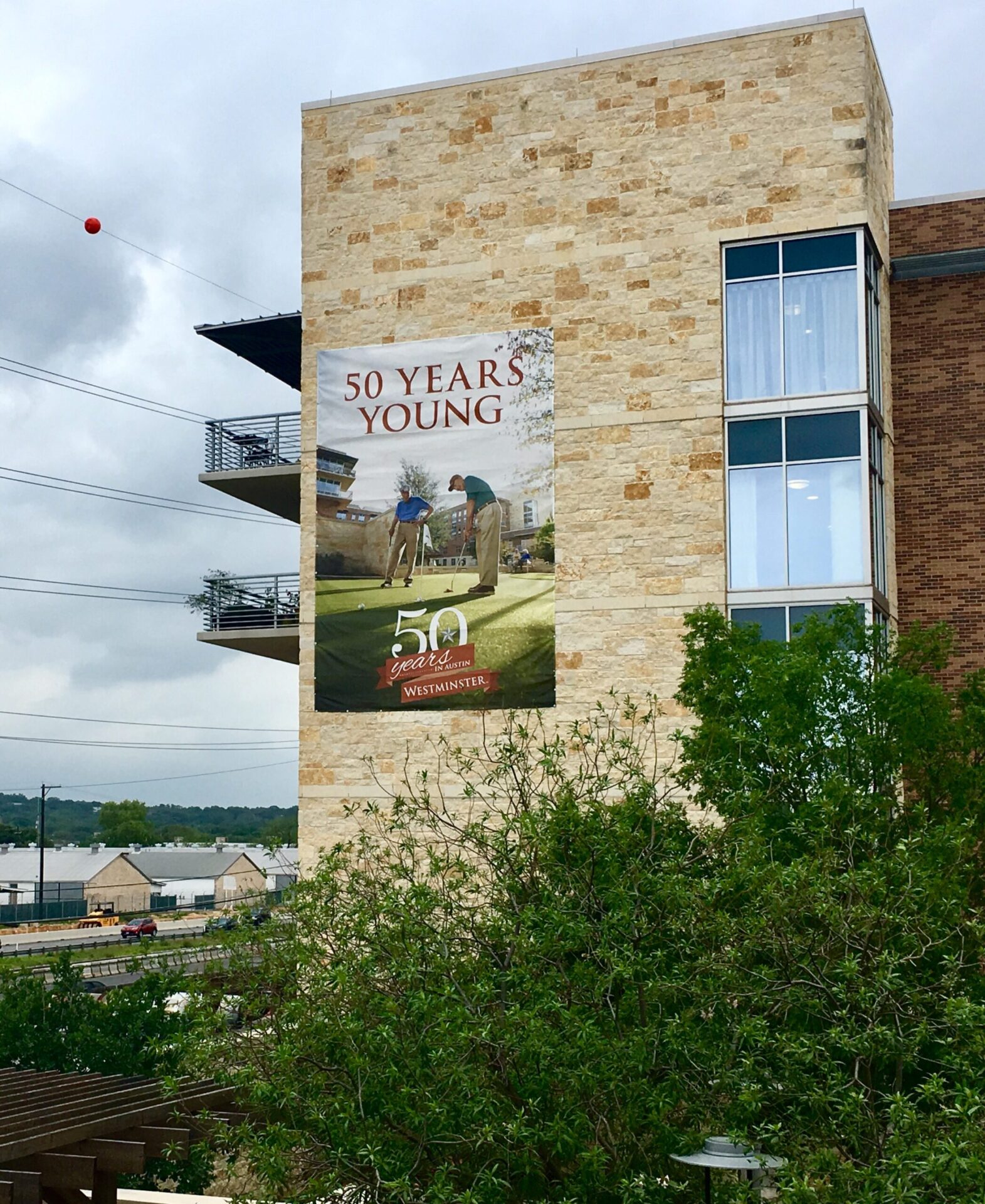 50 Years Young poster on a building