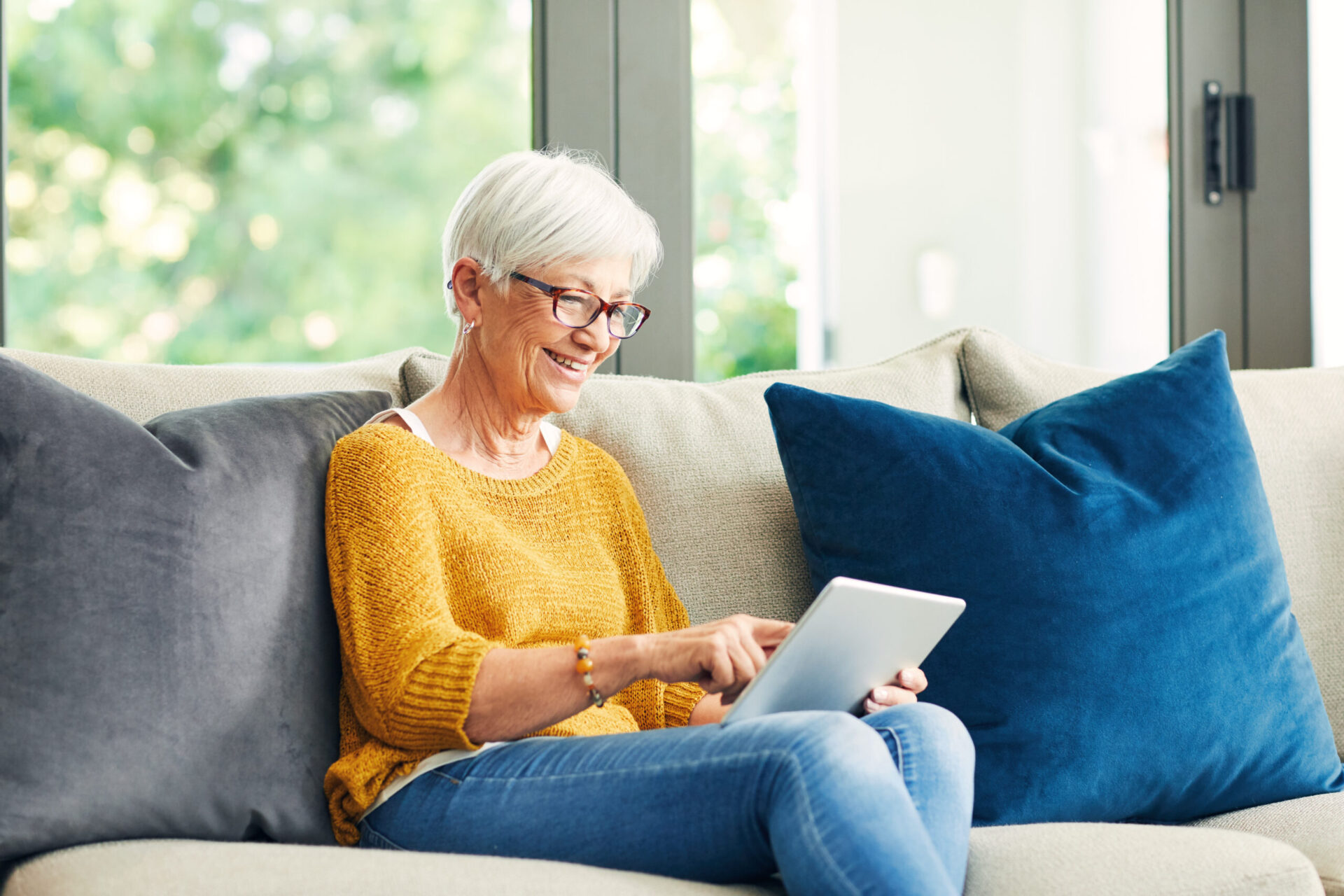 Senior woman using tablet computer