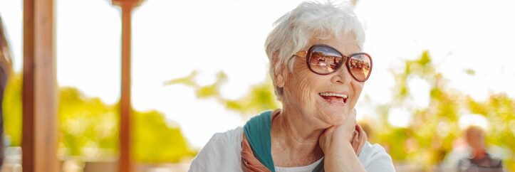 Senior woman relaxing on outdoor patio