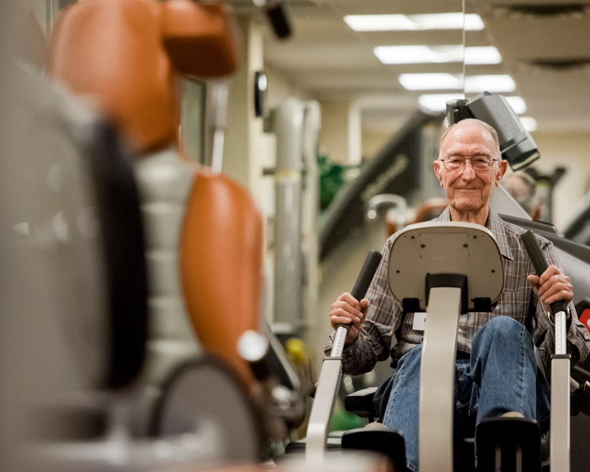 senior man on rehabilitation exercise machine