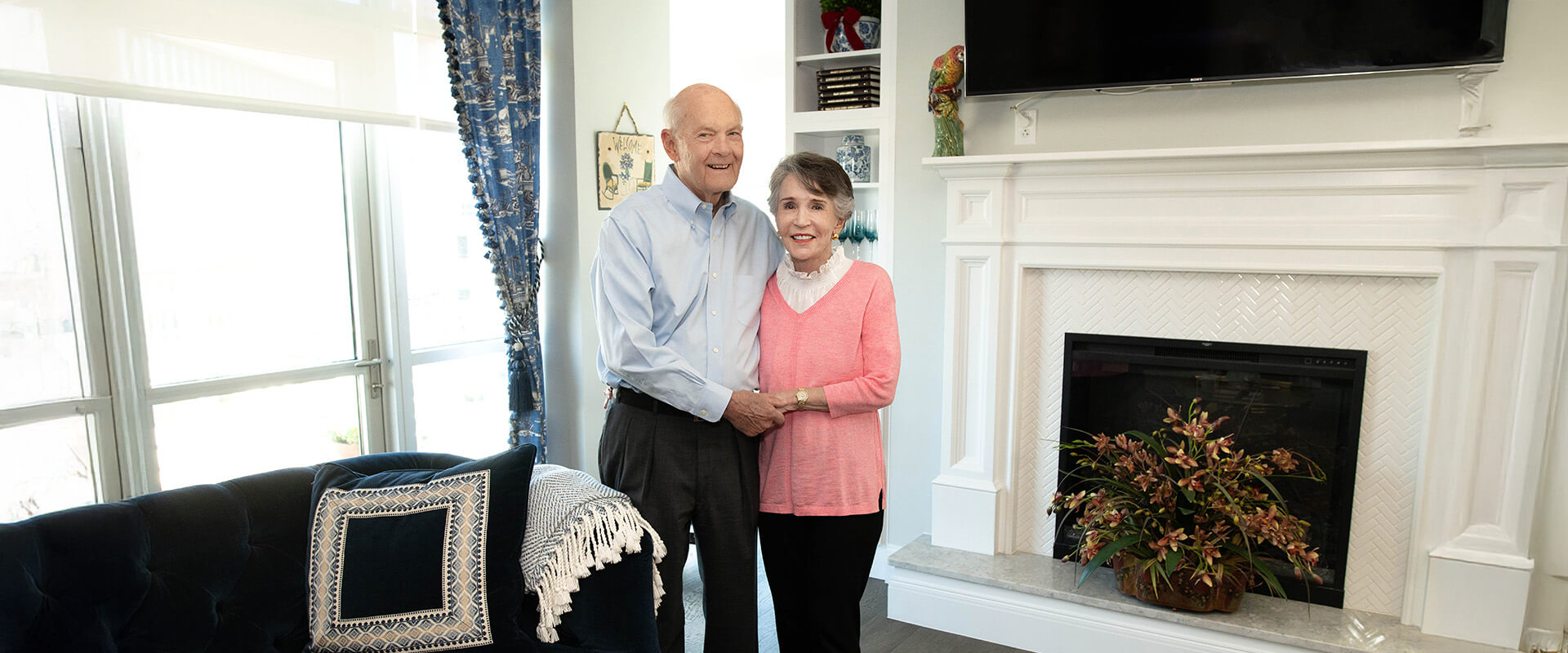 westminster-texas-couple-embrace Elderly couple embrace while standing in their Westminster apartment